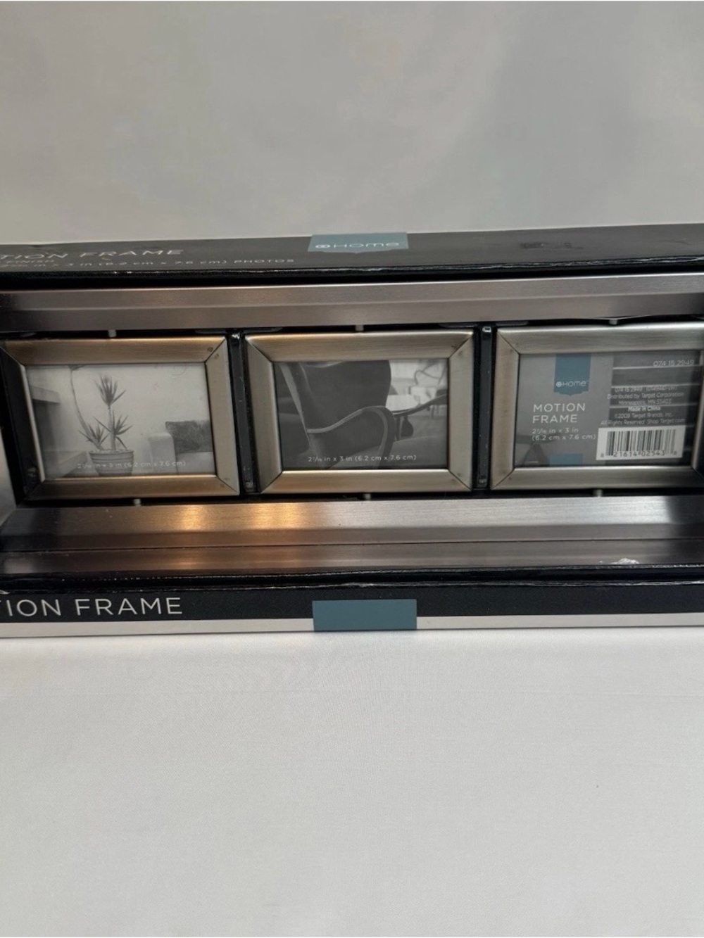 The NEW TARGET Home Motion Picture Frame.  six 3" × 2-7/16" photos in a collage